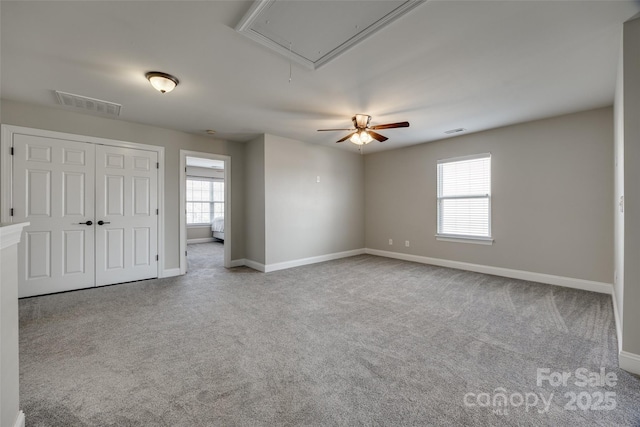 10071 Highland Creek Cir, Indian Land, SC 29707 - interior space with visible vents, baseboards, a ceiling fan, attic access, and carpet flooring