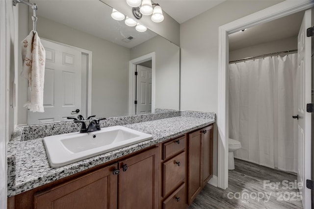 10071 Highland Creek Cir, Indian Land, SC 29707 - bathroom featuring visible vents, toilet, vanity, and wood finished floors