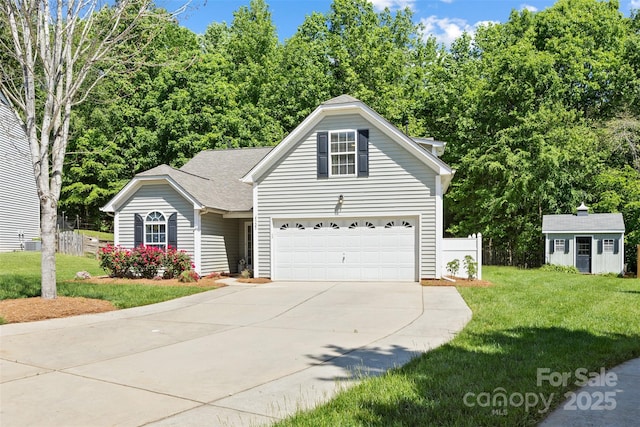 4323 Wiregrass Rd, Indian Land, SC 29707 - view of front of property featuring concrete driveway, an attached garage, fence, and a front lawn