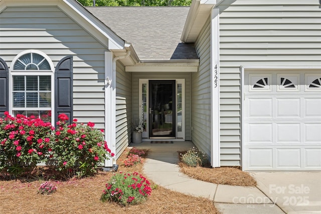 4323 Wiregrass Rd, Indian Land, SC 29707 - doorway to property featuring a garage and roof with shingles