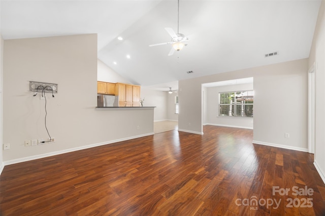 4323 Wiregrass Rd, Indian Land, SC 29707 - unfurnished living room featuring ceiling fan, high vaulted ceiling, baseboards, wood finished floors, and visible vents