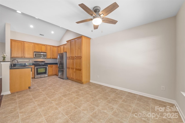 4323 Wiregrass Rd, Indian Land, SC 29707 - kitchen featuring dark countertops, a sink, stainless steel appliances, a ceiling fan, and vaulted ceiling