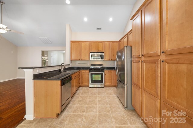 4323 Wiregrass Rd, Indian Land, SC 29707 - kitchen with visible vents, a ceiling fan, a peninsula, a sink, and appliances with stainless steel finishes