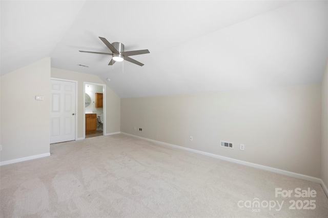 4323 Wiregrass Rd, Indian Land, SC 29707 - additional living space with visible vents, baseboards, lofted ceiling, and light colored carpet