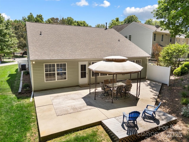 4323 Wiregrass Rd, Indian Land, SC 29707 - back of property featuring fence, a patio area, and roof with shingles