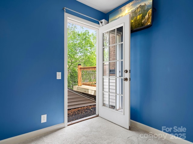 9009 Stourbridge Dr, Huntersville, NC 28078 - doorway to outside featuring carpet flooring and baseboards
