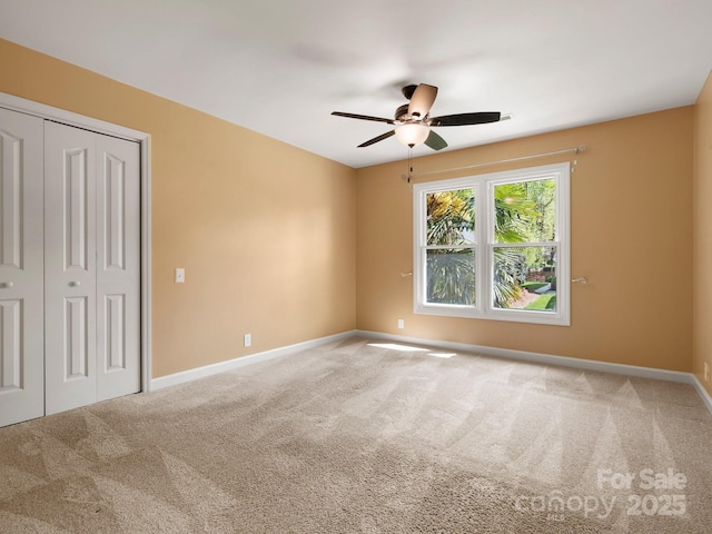 9009 Stourbridge Dr, Huntersville, NC 28078 - unfurnished bedroom with carpet flooring, baseboards, a closet, and a ceiling fan