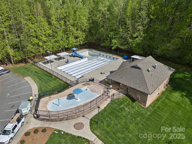 9009 Stourbridge Dr, Huntersville, NC 28078 - drone / aerial view of a pool and a heavily wooded area