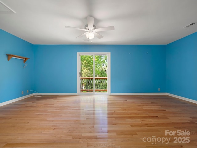 9009 Stourbridge Dr, Huntersville, NC 28078 - empty room with ceiling fan, wood finished floors, and baseboards