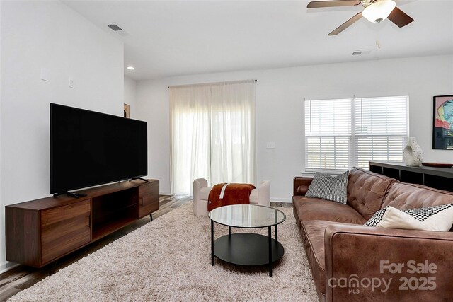 living room with visible vents, recessed lighting, a ceiling fan, and wood finished floors