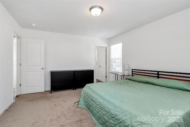 carpeted bedroom with baseboards