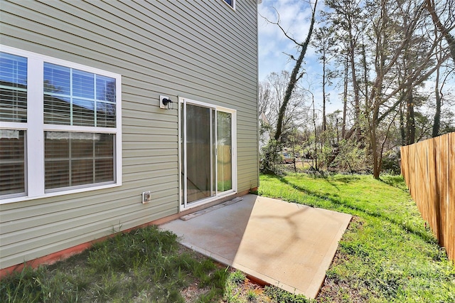 view of patio / terrace featuring fence