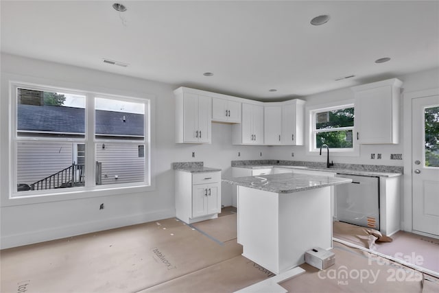 515 Harrel St, Salisbury, NC 28144 - kitchen with dishwasher, white cabinets, and light stone counters