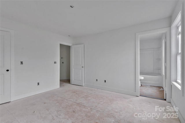 515 Harrel St, Salisbury, NC 28144 - unfurnished bedroom featuring baseboards and ensuite bathroom