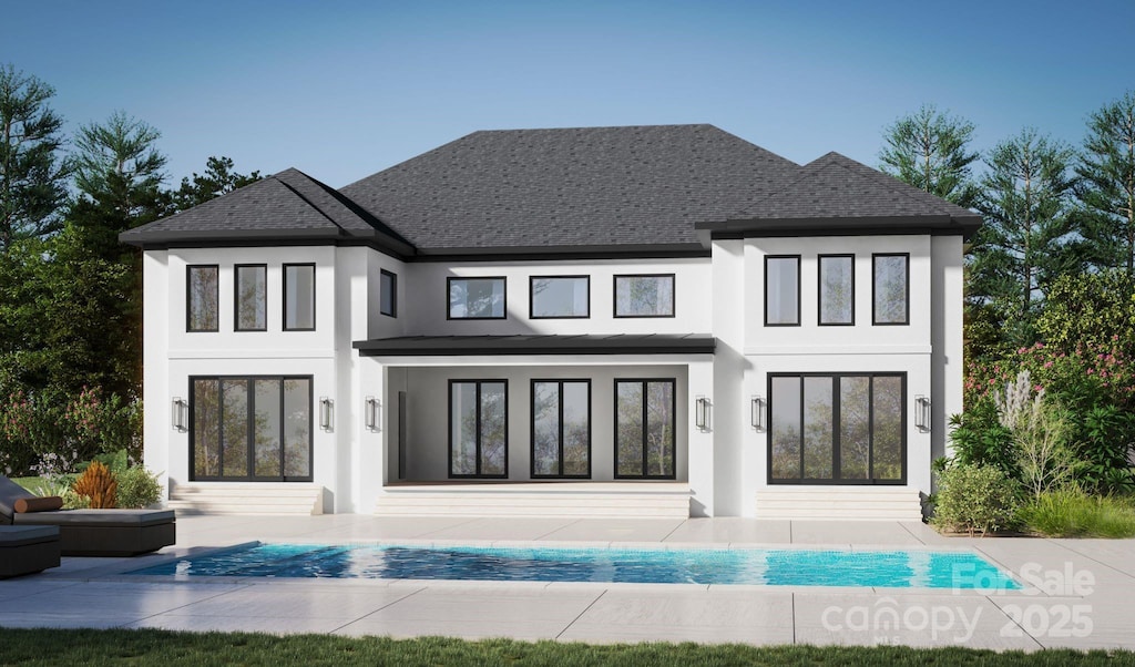 rear view of property with a patio area, an outdoor pool, and stucco siding
