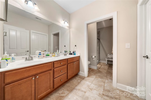 7909 Parknoll Dr, Huntersville, NC 28078 - bathroom with visible vents, a shower stall, toilet, double vanity, and a sink