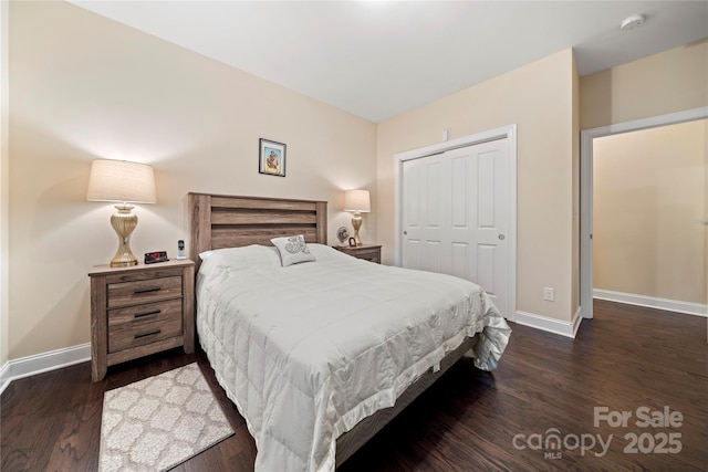 7909 Parknoll Dr, Huntersville, NC 28078 - bedroom with a closet, baseboards, and wood finished floors