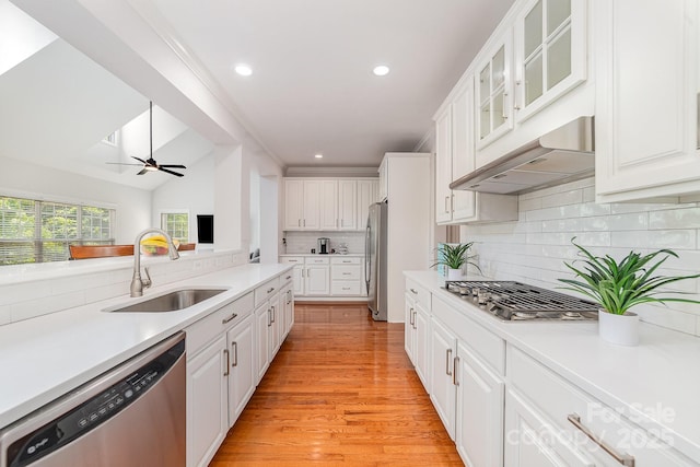 615 Vega St NW, Concord, NC 28027 - kitchen featuring appliances with stainless steel finishes, under cabinet range hood, a sink, white cabinets, and recessed lighting