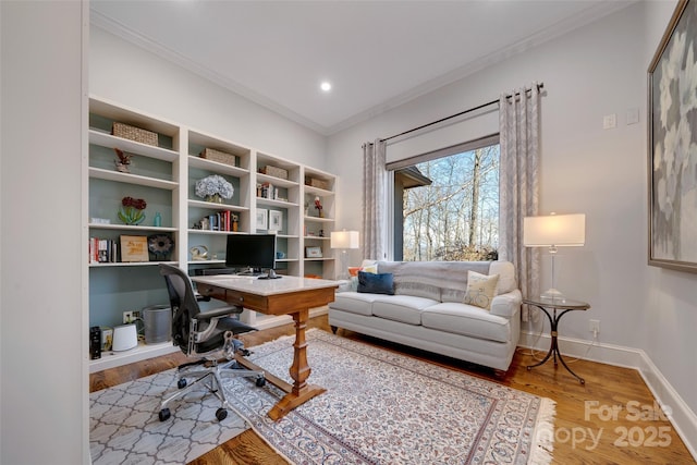 office space featuring ornamental molding, baseboards, light wood-style floors, and recessed lighting