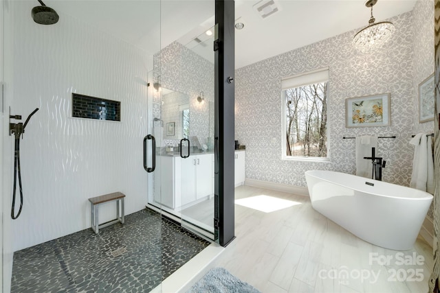 bathroom with baseboards, a soaking tub, wallpapered walls, a stall shower, and visible vents