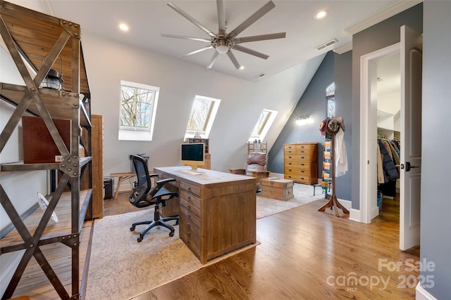 office with a ceiling fan, a skylight, light wood-style flooring, visible vents, and recessed lighting