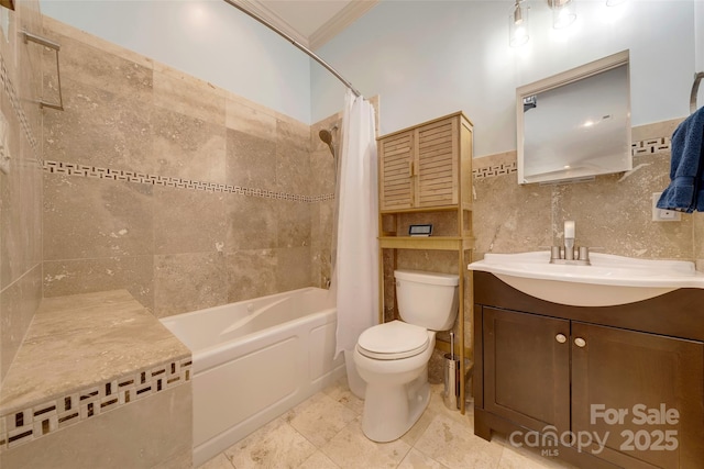 bathroom featuring toilet, vanity, shower / bathtub combination with curtain, ornamental molding, and tile walls
