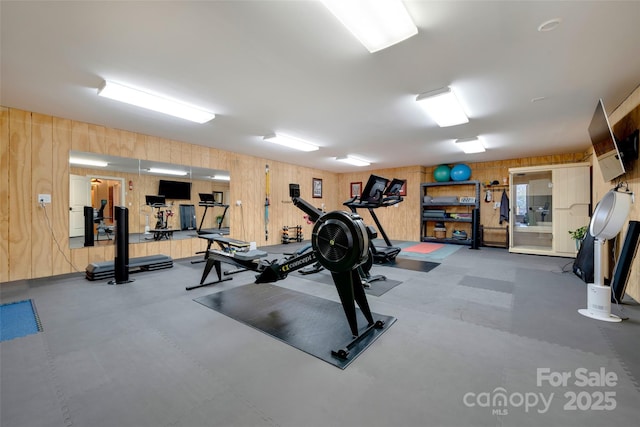 exercise area with wood walls