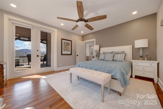 bedroom with access to exterior, french doors, wood finished floors, baseboards, and recessed lighting