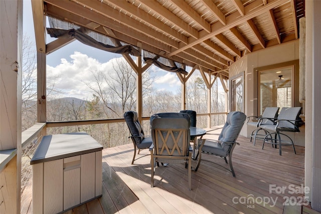 wooden terrace featuring a mountain view
