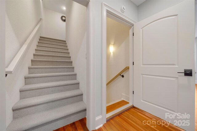 stairs with wood finished floors