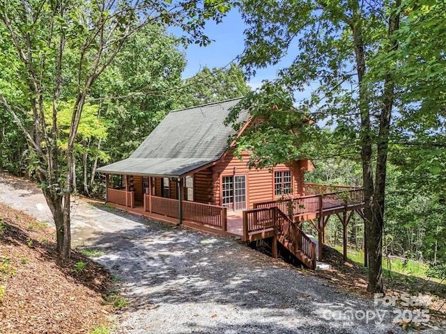 522 Woodgate Dr, Bostic, NC 28018 - view of front of property featuring log siding, driveway, and a deck