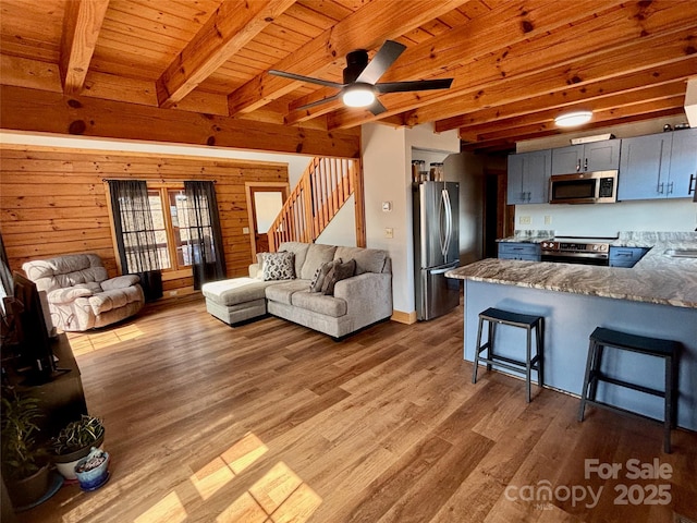 522 Woodgate Dr, Bostic, NC 28018 - living room featuring wooden ceiling, stairs, beamed ceiling, light wood finished floors, and a ceiling fan