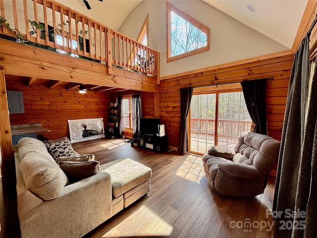 522 Woodgate Dr, Bostic, NC 28018 - living area with a ceiling fan, wooden walls, high vaulted ceiling, and hardwood / wood-style floors