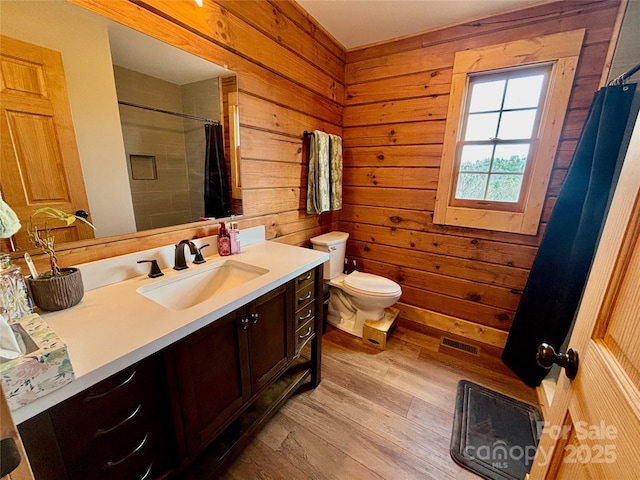 522 Woodgate Dr, Bostic, NC 28018 - full bath with wood finished floors, vanity, toilet, a shower with curtain, and wooden walls
