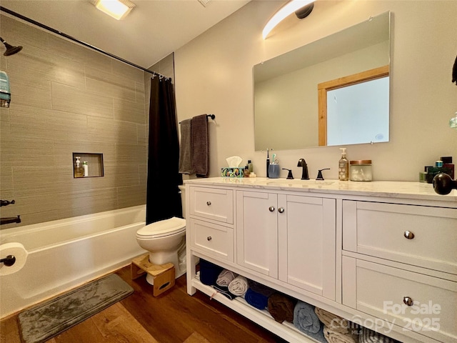 522 Woodgate Dr, Bostic, NC 28018 - bathroom with wood finished floors, toilet, shower / bath combination with curtain, and vanity