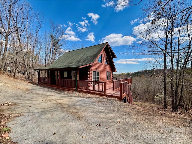 522 Woodgate Dr, Bostic, NC 28018 - view of home's exterior featuring log exterior, a wooden deck, and a shingled roof