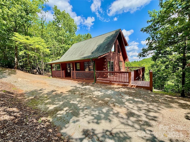522 Woodgate Dr, Bostic, NC 28018 - view of side of home featuring a wooden deck, roof with shingles, and log siding