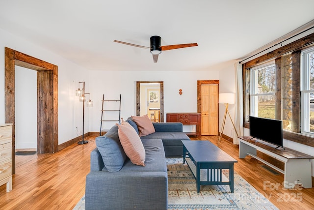 323 Emma Rd, Asheville, NC 28806 - living room featuring a ceiling fan, baseboards, light wood finished floors, and visible vents