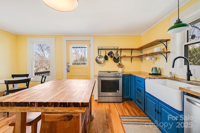 323 Emma Rd, Asheville, NC 28806 - kitchen with wooden counters, appliances with stainless steel finishes, a sink, open shelves, and blue cabinets