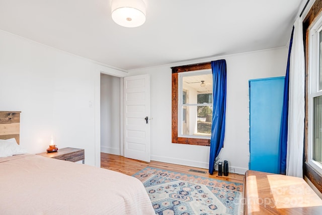323 Emma Rd, Asheville, NC 28806 - bedroom with wood finished floors, baseboards, and visible vents