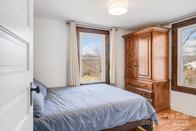 323 Emma Rd, Asheville, NC 28806 - bedroom featuring light wood finished floors and ornamental molding