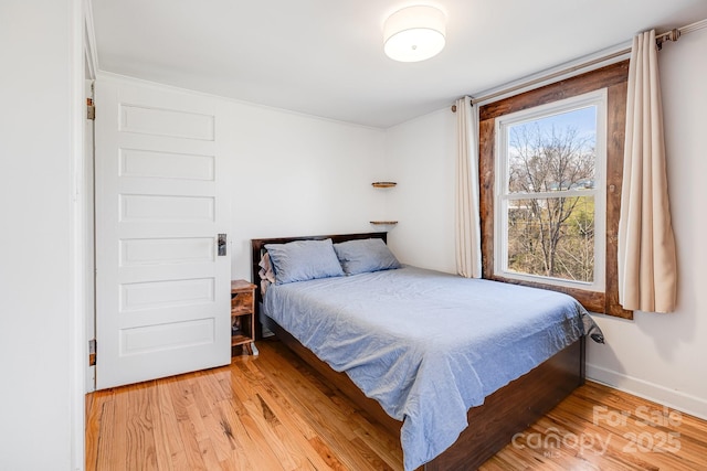 323 Emma Rd, Asheville, NC 28806 - bedroom with baseboards and light wood-type flooring