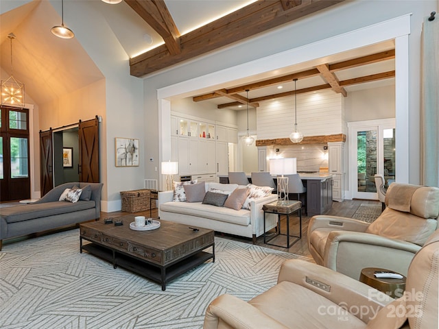 living room with beamed ceiling, a high ceiling, wood finished floors, and coffered ceiling