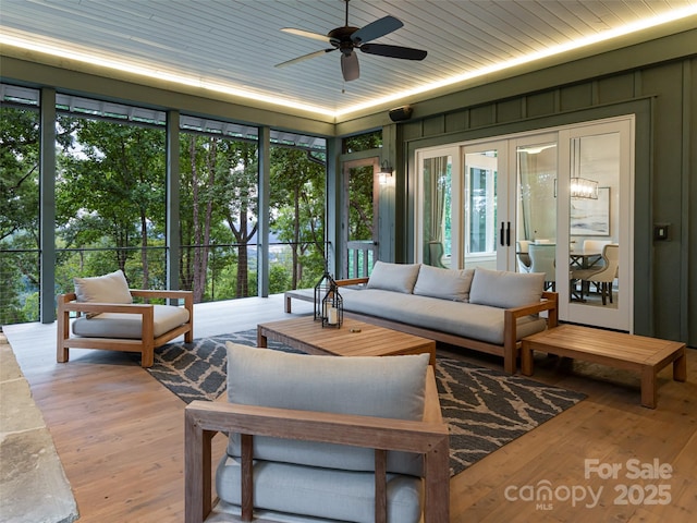 living room with expansive windows, wood-type flooring, ceiling fan, and wooden ceiling