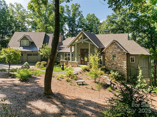 craftsman inspired home with a standing seam roof, stone siding, metal roof, and roof with shingles