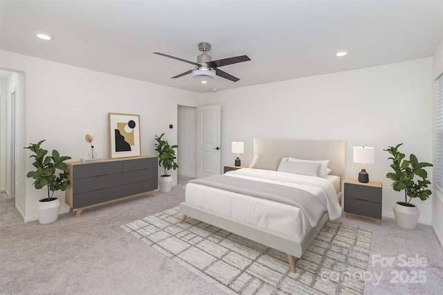 carpeted bedroom with recessed lighting, baseboards, and a ceiling fan