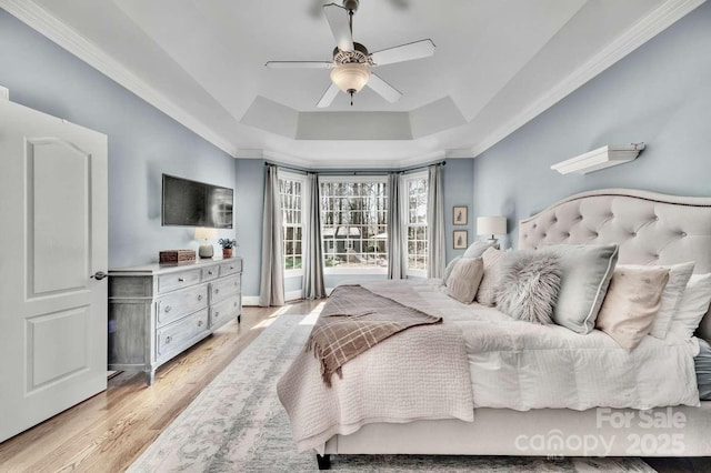 4536 Rustling Woods Dr, Denver, NC 28037 - bedroom featuring a tray ceiling, light wood-type flooring, a ceiling fan, and crown molding