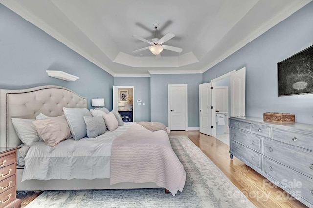 4536 Rustling Woods Dr, Denver, NC 28037 - bedroom featuring a raised ceiling, light wood-style floors, crown molding, and ceiling fan