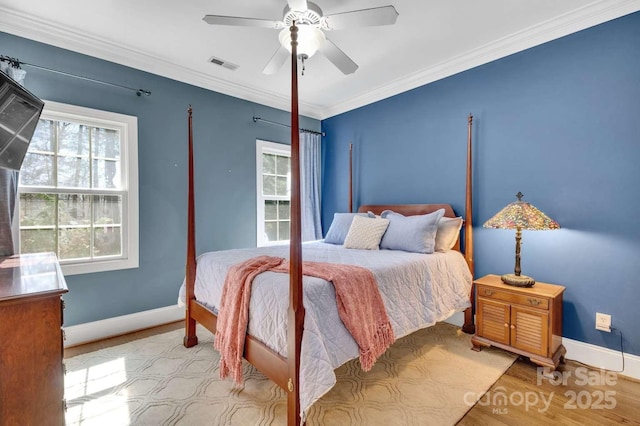 4536 Rustling Woods Dr, Denver, NC 28037 - bedroom featuring baseboards, wood finished floors, ornamental molding, and a ceiling fan