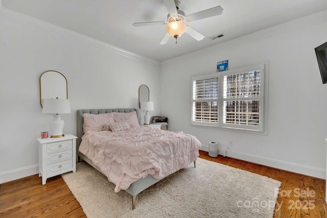 4536 Rustling Woods Dr, Denver, NC 28037 - bedroom with ornamental molding, baseboards, light wood-style floors, and a ceiling fan